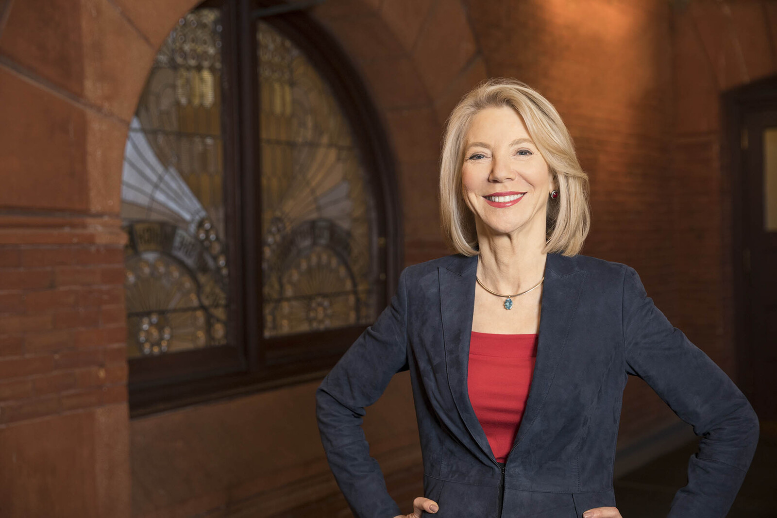 President Gutmann in front of ornate window in Fisher Fine Arts